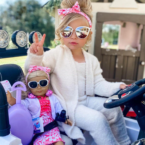 18 Inch doll in travel outfit with child having fun