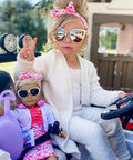 18 Inch doll in travel outfit with child having fun
